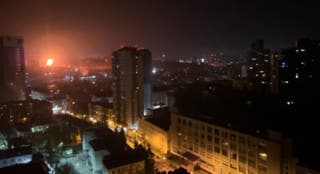 In this image taken from video, an explosion is seen in the distance as a Russian attack targets Ukraine's Kyiv region on Friday, 14 November 2025
